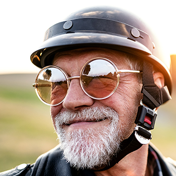 Smiling Man Wearing Helmet and glasses